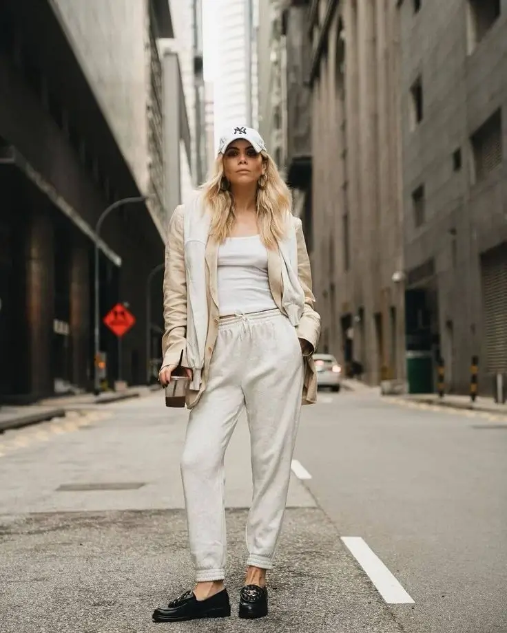 Blazer with layered hoodies, sweatpants, and loafers